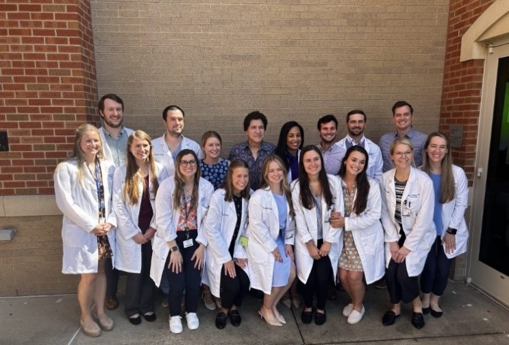 Dr. James Del Rosso, August Grand Rounds speaker, pictured with Dermatology's residents.